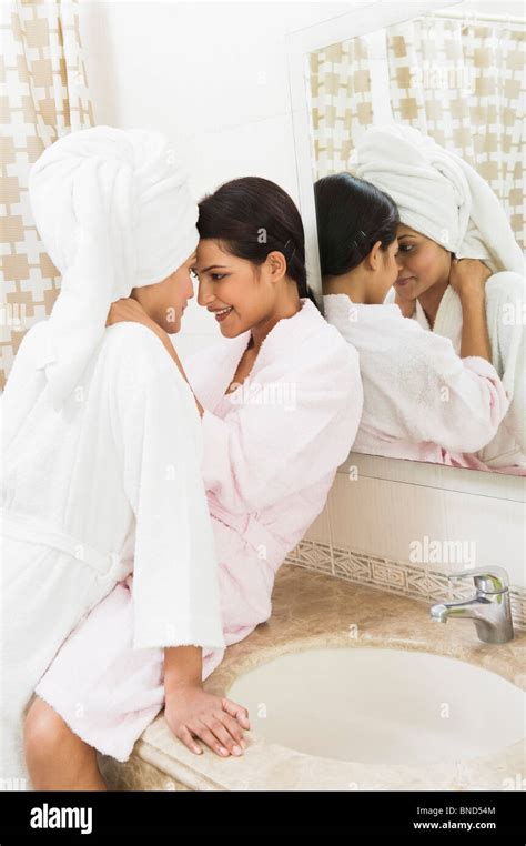 lesbian in the shower|Romantic lesbian couple taking bath together and relaxing.